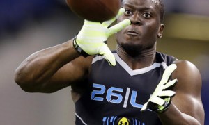 Notre Dame linebacker Prince Shembo makes a catch as he runs a drill at the NFL football scouting combine in Indianapolis, Monday, Feb. 24, 2014. (AP Photo/Michael Conroy)